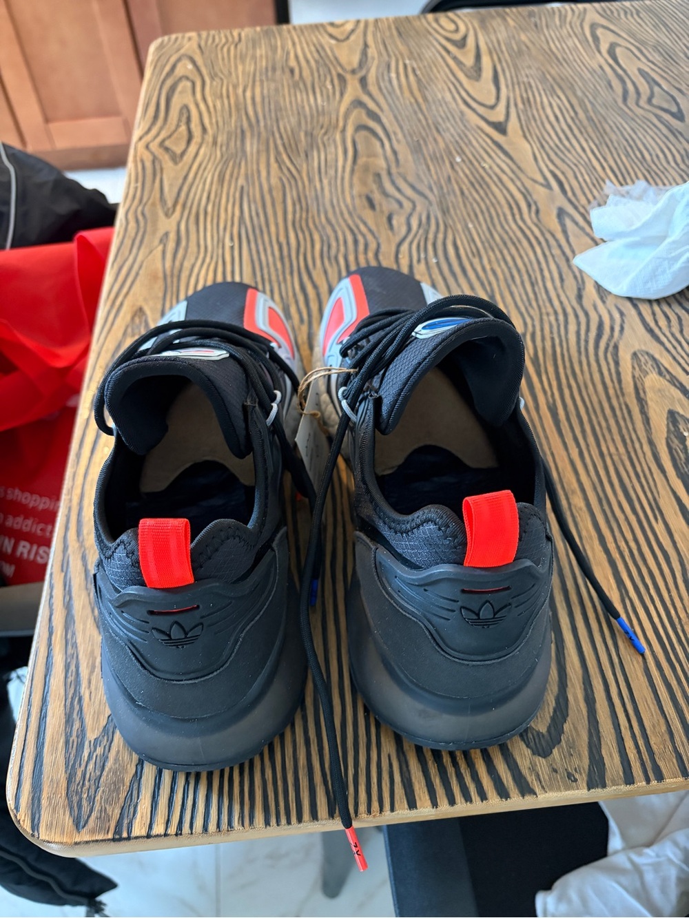 adidas Black Sneakers with Red Pull Tabs and Blue Accents